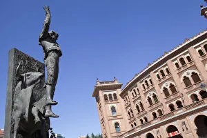 Spain, Madrid, Statue of a matador with the Plaza de Toros de las Ventas in the Spain, Madrid, Statue of a matador with the Plaza de Toros de las Ventas in the