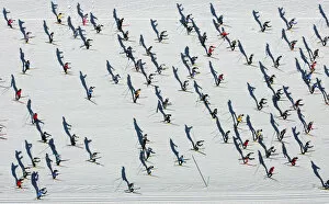 Switzerland Collection: Aerial view of cross country skiers racing over the frozen Lake Sils during the Engadin