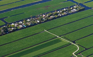 Netherlands Collection: Aerial view of houses surrounded by water near Amsterdam