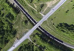 An aerial view shows a train and vehicles moving in Krasnoyarsk region An aerial view shows a train and vehicles moving in Krasnoyarsk region