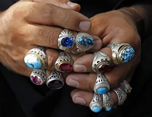 Afghan vendor wears rings on his fingers to attract customers ahead of Eid-al-Fitr in Afghan vendor wears rings on his fingers to attract customers ahead of Eid-al-Fitr in