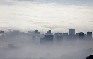 An airplane flies over buildings in Rio de Janeiro An airplane flies over buildings in Rio de Janeiro