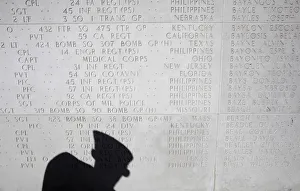 An American views the memorial hall where the names of fallen U An American views the memorial hall where the names of fallen U