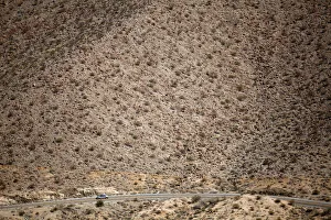 Automobile travels through California desert mountains Automobile travels through California desert mountains