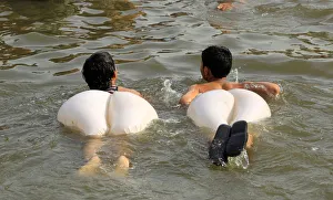 Boys swim in a stream during a heatwave in Islamabad Boys swim in a stream during a heatwave in Islamabad