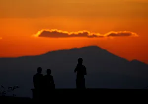 Boys watch atop the roof of their house on the Turkish-Syrian border line in Reyhanli Boys watch atop the roof of their house on the Turkish-Syrian border line in Reyhanli