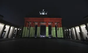 Brandenburg Gate is illuminated to commemorate the 12 killed victims of a truck that Brandenburg Gate is illuminated to commemorate the 12 killed victims of a truck that