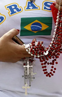 A Brazilian faithful holds rosaries as Pope Benedict XVI leads the Sunday Angelus prayer A Brazilian faithful holds rosaries as Pope Benedict XVI leads the Sunday Angelus prayer