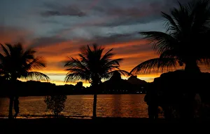 A Brazilian walks at sunset on Rodrigo de Freitas Lake in Rio A Brazilian walks at sunset on Rodrigo de Freitas Lake in Rio