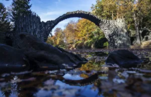 The Bridge Rakotzbr?cke is pictured against trees in autumn colours in the the eastern The Bridge Rakotzbr?cke is pictured against trees in autumn colours in the the eastern