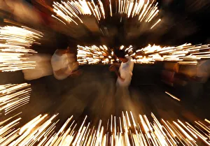 Buddhist devotees light oil lamps at Gangaramaya temple as part of celebrations for the Buddhist devotees light oil lamps at Gangaramaya temple as part of celebrations for the