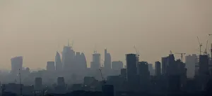 Buildings and construction cranes are seen through a heat haze in London Buildings and construction cranes are seen through a heat haze in London