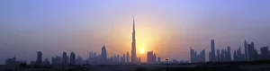 The Burj Khalifa is seen as the sun sets over Dubai The Burj Khalifa is seen as the sun sets over Dubai