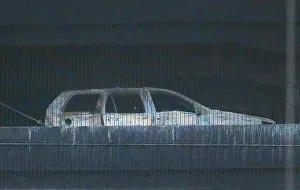 The burned out shell of a car is seen following a serious blaze which destroyed hundreds The burned out shell of a car is seen following a serious blaze which destroyed hundreds