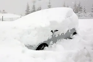 A car is seen during heavy snowfall in Claviere A car is seen during heavy snowfall in Claviere