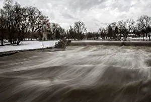Cayuga Creek water rushes past a neighbourhood following a massive snow storm in Cayuga Creek water rushes past a neighbourhood following a massive snow storm in
