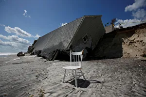 A chair is pictured outside a collapsed coastal house after Hurricane Irma passed the A chair is pictured outside a collapsed coastal house after Hurricane Irma passed the