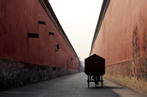 Images Dated 28th October 2004: A Chinese cyclist pedals inside the Forbidden City in Beijing