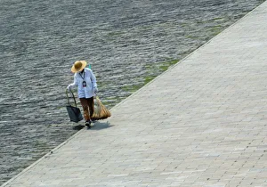 A CLEANER WALKS THROUGH THE FORBIDDEN CITY IN BEIJING A CLEANER WALKS THROUGH THE FORBIDDEN CITY IN BEIJING