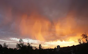 Cloud formations are illuminated by the sun as it sets in Los Angeles Cloud formations are illuminated by the sun as it sets in Los Angeles