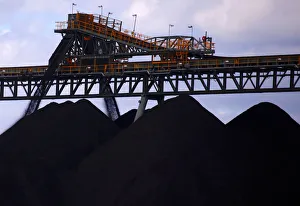 Coal is unloaded onto large piles at the Ulan Coal mines near the central New South Wales Coal is unloaded onto large piles at the Ulan Coal mines near the central New South Wales