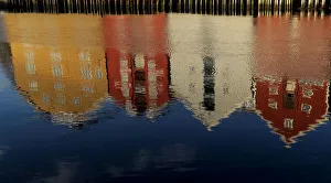 Coloured houses are reflected on the waterfront in Trondheim Coloured houses are reflected on the waterfront in Trondheim