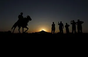 Competitors prepare for horse race as they pay homage at the shrine of the Muslim Competitors prepare for horse race as they pay homage at the shrine of the Muslim