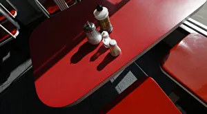 Condiments are seen on a table inside The Arsenal Fish Bar restaurant in north London Condiments are seen on a table inside The Arsenal Fish Bar restaurant in north London