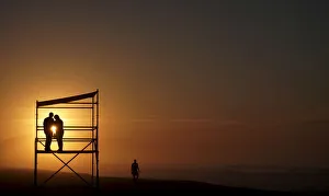 A couple is pictured during a sunrise on Recreio dos Bandeirantes beach in Rio de Janeiro A couple is pictured during a sunrise on Recreio dos Bandeirantes beach in Rio de Janeiro