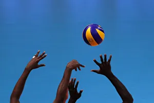 Cubas players try to block the ball during their match against Italy in the Volleyball Cubas players try to block the ball during their match against Italy in the Volleyball