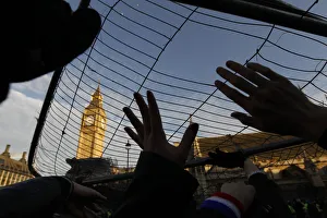 Demonstrators hold barriers above their heads in Parliament Square in central London Demonstrators hold barriers above their heads in Parliament Square in central London