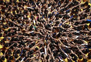 Devotees try to form a human pyramid to break a clay pot containing curd during celebrations Devotees try to form a human pyramid to break a clay pot containing curd during celebrations
