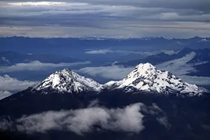 The double peak of the Illinizas are seen from a plane during a flight to Quito The double peak of the Illinizas are seen from a plane during a flight to Quito