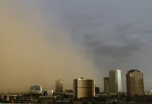 A dust storm surrounds high rise buildings in Phoenix A dust storm surrounds high rise buildings in Phoenix
