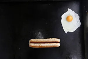 An egg and a sausage fry on a grill in Mays snack van along the A22 near Caterham An egg and a sausage fry on a grill in Mays snack van along the A22 near Caterham