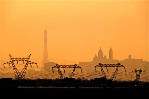 Electricity pylons of high-tension electricity power lines are seen in front of the Electricity pylons of high-tension electricity power lines are seen in front of the