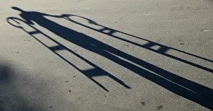 An employee of a traditional wooden sledge manufacturer casts his shadow in Boehen An employee of a traditional wooden sledge manufacturer casts his shadow in Boehen