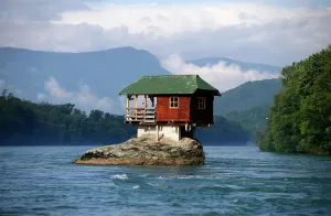 Prints of A house built on a rock on the river Drina is seen near the western Serbian town of Bajina Basta, about 160km (99 miles) from the capital Belgrade May 22, 2013 Serbia Prints: Print of a house built on a rock near Bajina Basta, Serbia