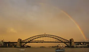 Evening rainbow sets above the Sydney Harbour Bridge Evening rainbow sets above the Sydney Harbour Bridge