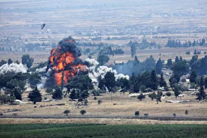 An explosion is seen at Quneitra at the Syrian side of the Israeli Syrian border as it is An explosion is seen at Quneitra at the Syrian side of the Israeli Syrian border as it is