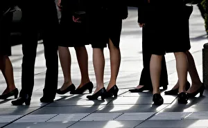 Female office workers wearing high heels, clothes and bags of the same colour are seen at Female office workers wearing high heels, clothes and bags of the same colour are seen at