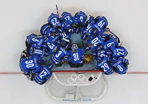 Finlands players gather during a pregame ritual before their womens ice hockey play-offs Finlands players gather during a pregame ritual before their womens ice hockey play-offs