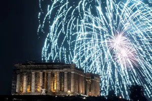 Fireworks explode over the ancient Parthenon temple atop the Acropolis hill during New Fireworks explode over the ancient Parthenon temple atop the Acropolis hill during New