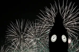 Fireworks explode by the Big Ben clocktower in London Fireworks explode by the Big Ben clocktower in London