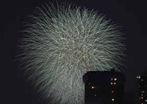 Fireworks explode over high-rise buildings during the Sumida River Fireworks Festival Fireworks explode over high-rise buildings during the Sumida River Fireworks Festival
