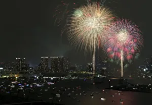 Fireworks explode over small ships on the Tokyos Odaiba bay during the Tokyo bay Fireworks explode over small ships on the Tokyos Odaiba bay during the Tokyo bay