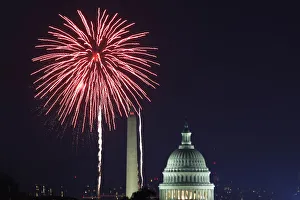 Fireworks light up the sky over the United States Capitol dome and the Washington Fireworks light up the sky over the United States Capitol dome and the Washington