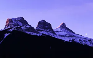 The first light of the day hits the Three Sisters Mountain range The first light of the day hits the Three Sisters Mountain range
