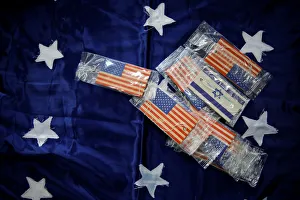 Flags of the United States and Israel are seen printed on car fresheners at a workshop Flags of the United States and Israel are seen printed on car fresheners at a workshop