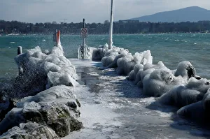 A frozen pier is seen during a windy winter day near Lake Leman in Geneva A frozen pier is seen during a windy winter day near Lake Leman in Geneva